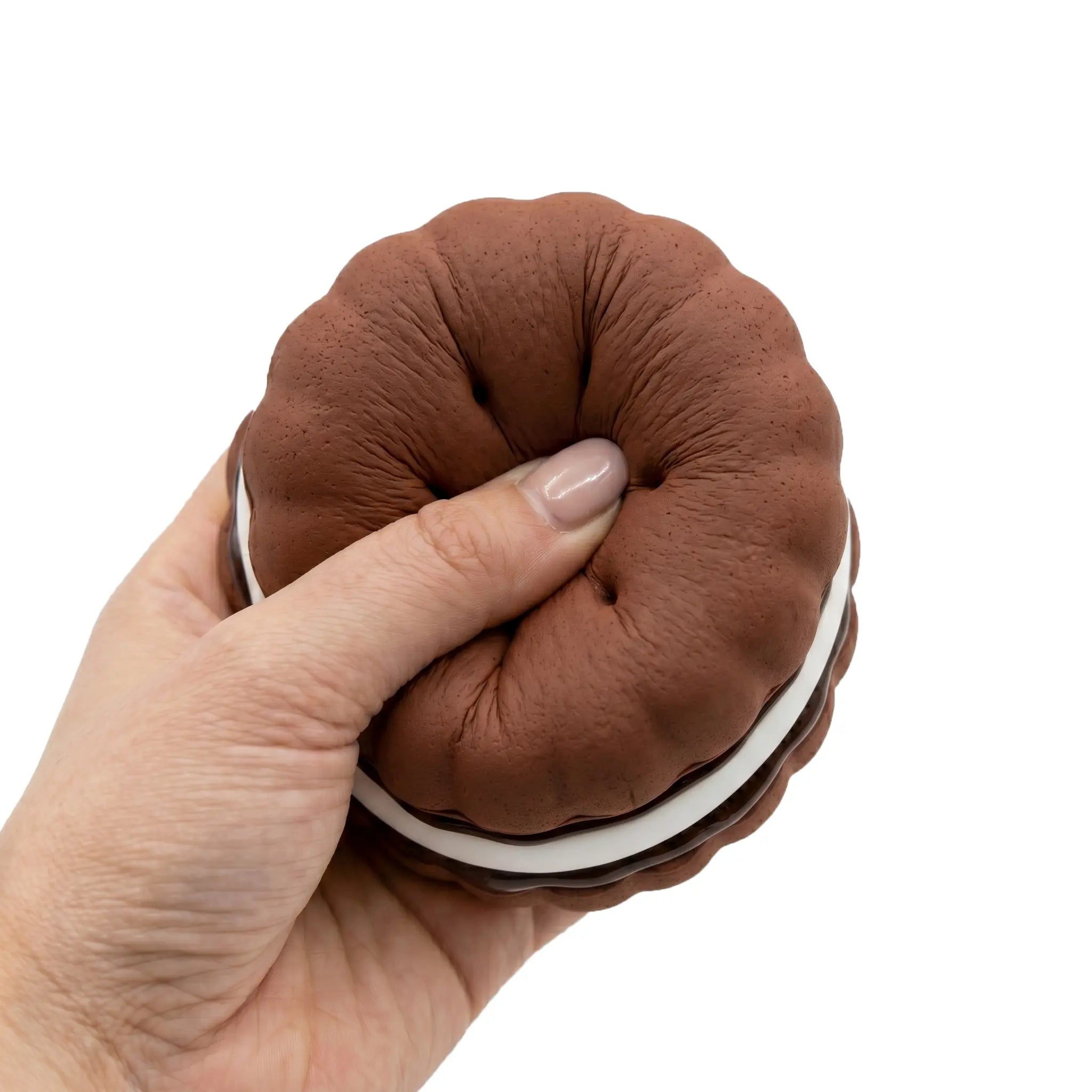 Chocolate brown macaron squishy toy being pressed and squeezed on white background by MimiSquishy