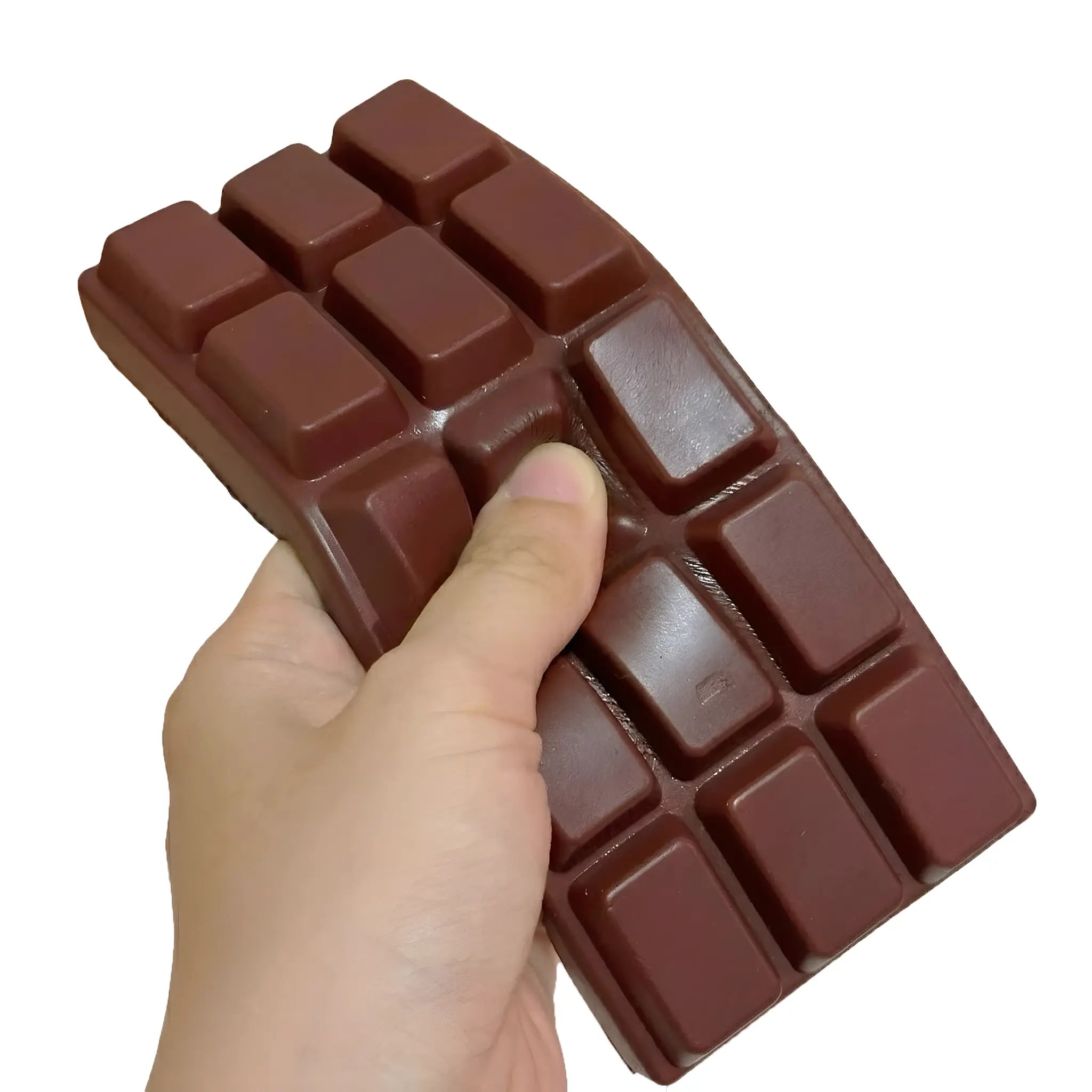 Dark chocolate bar squishy toy being pressed and squeezed on white background by MimiSquishy