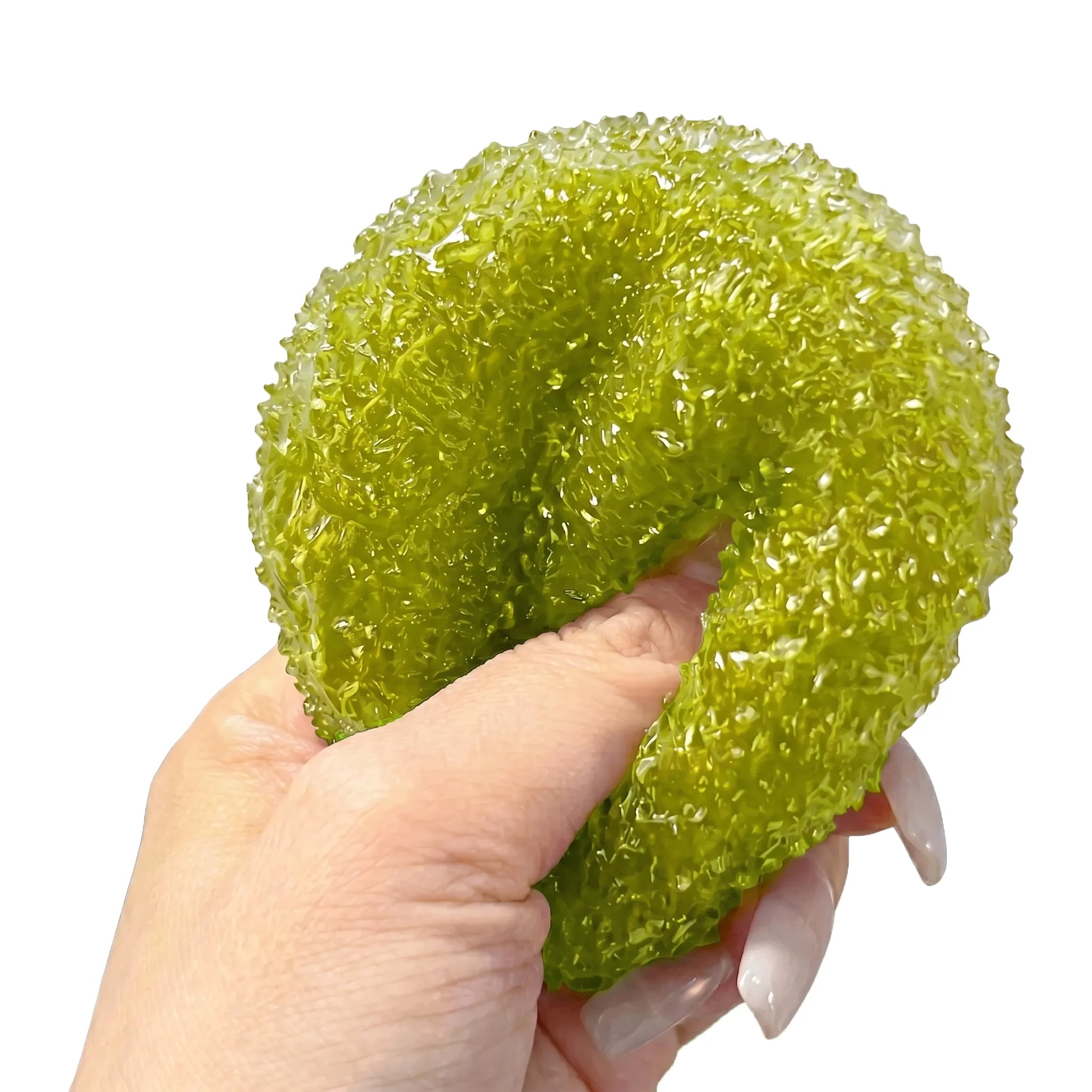 Green crystal mochi ball squishy toy being pressed and squeezed on white background by MimiSquishy