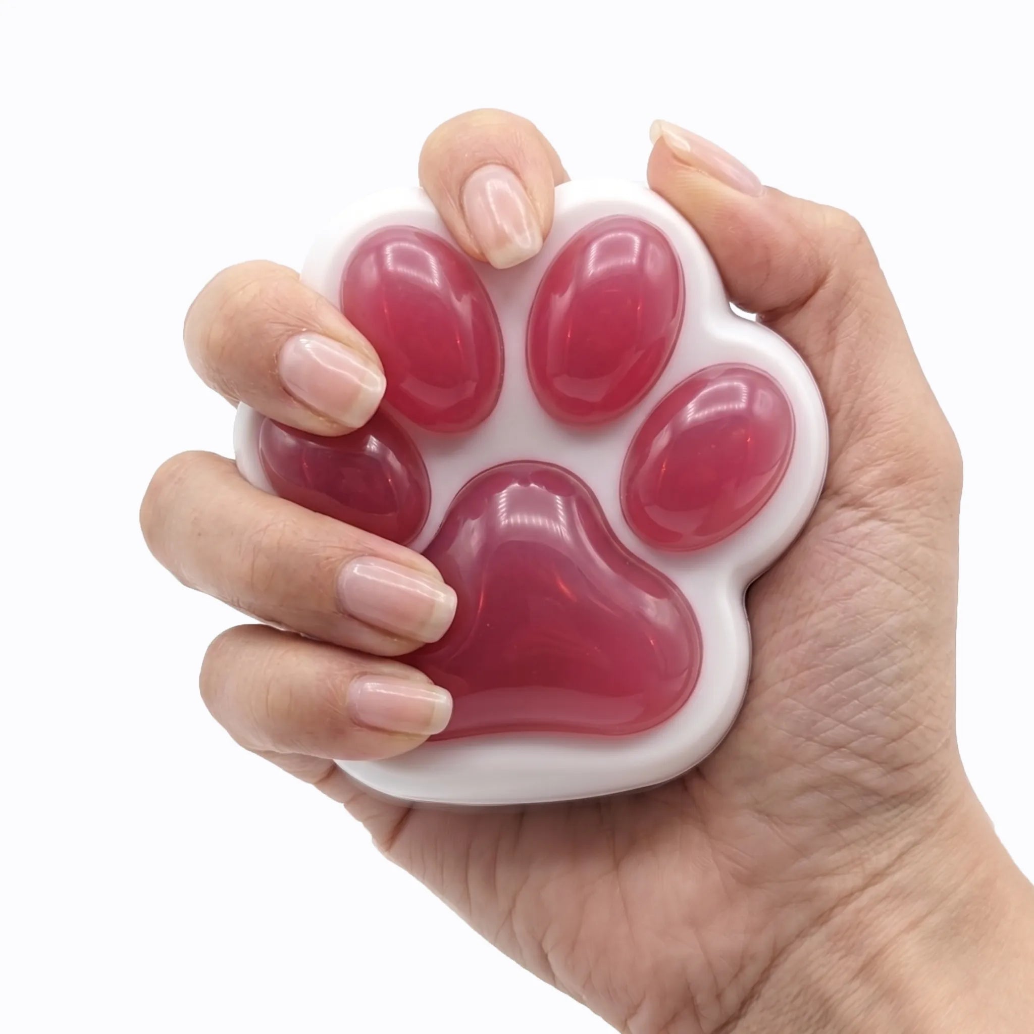Pink cat paw squishy toy being pressed and squeezed on white background by MimiSquishy