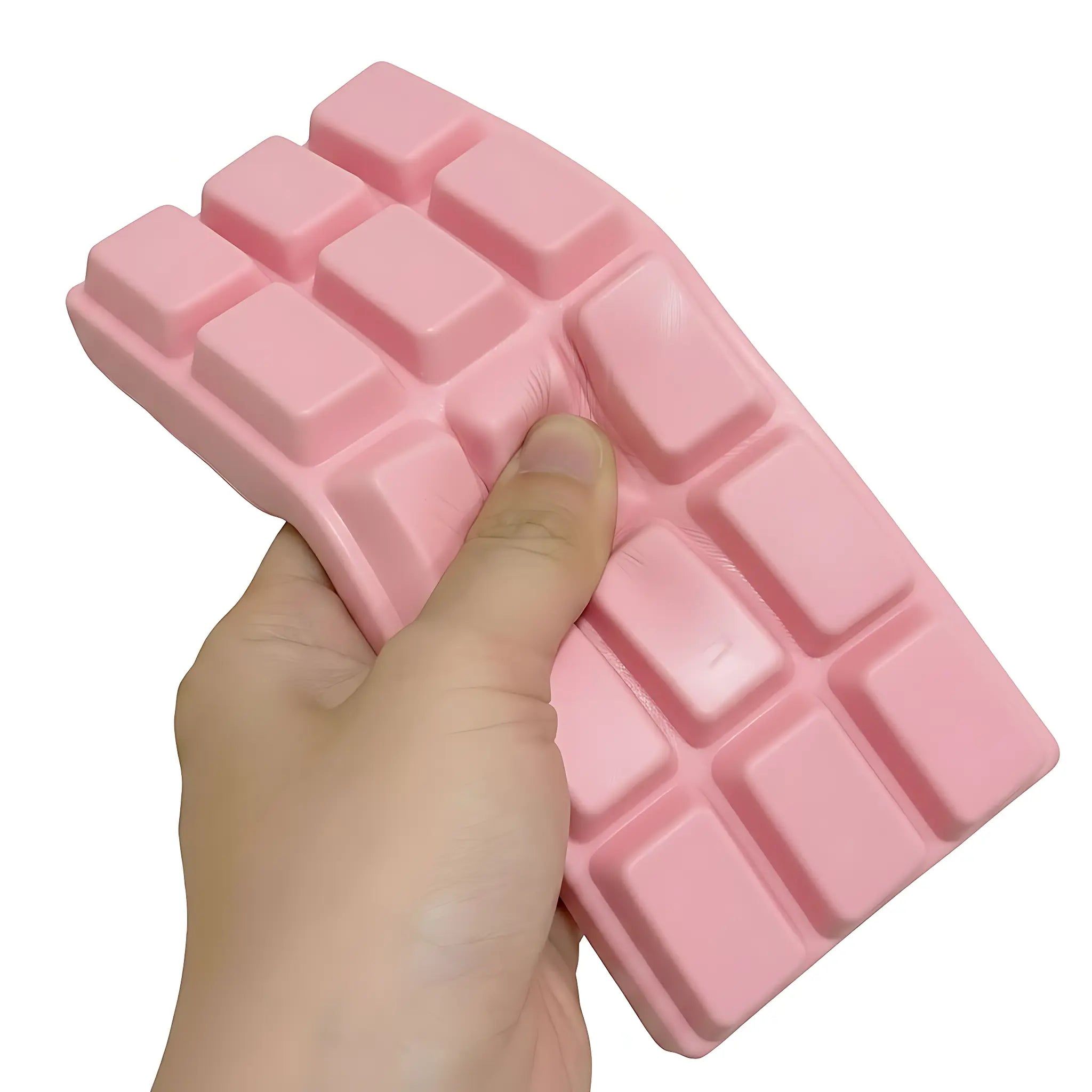 Pink chocolate bar squishy toy being pressed and squeezed on white background by MimiSquishy