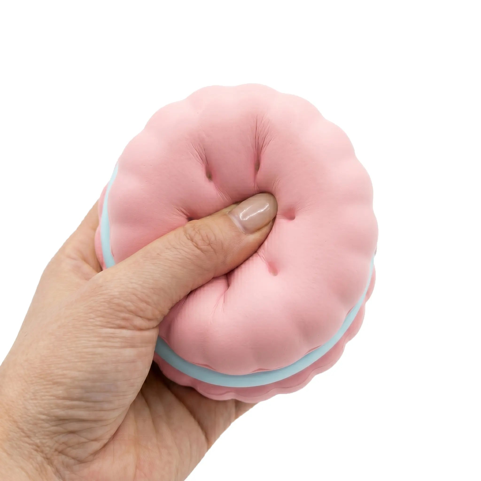 Pink macaron squishy toy being pressed and squeezed on white background by MimiSquishy