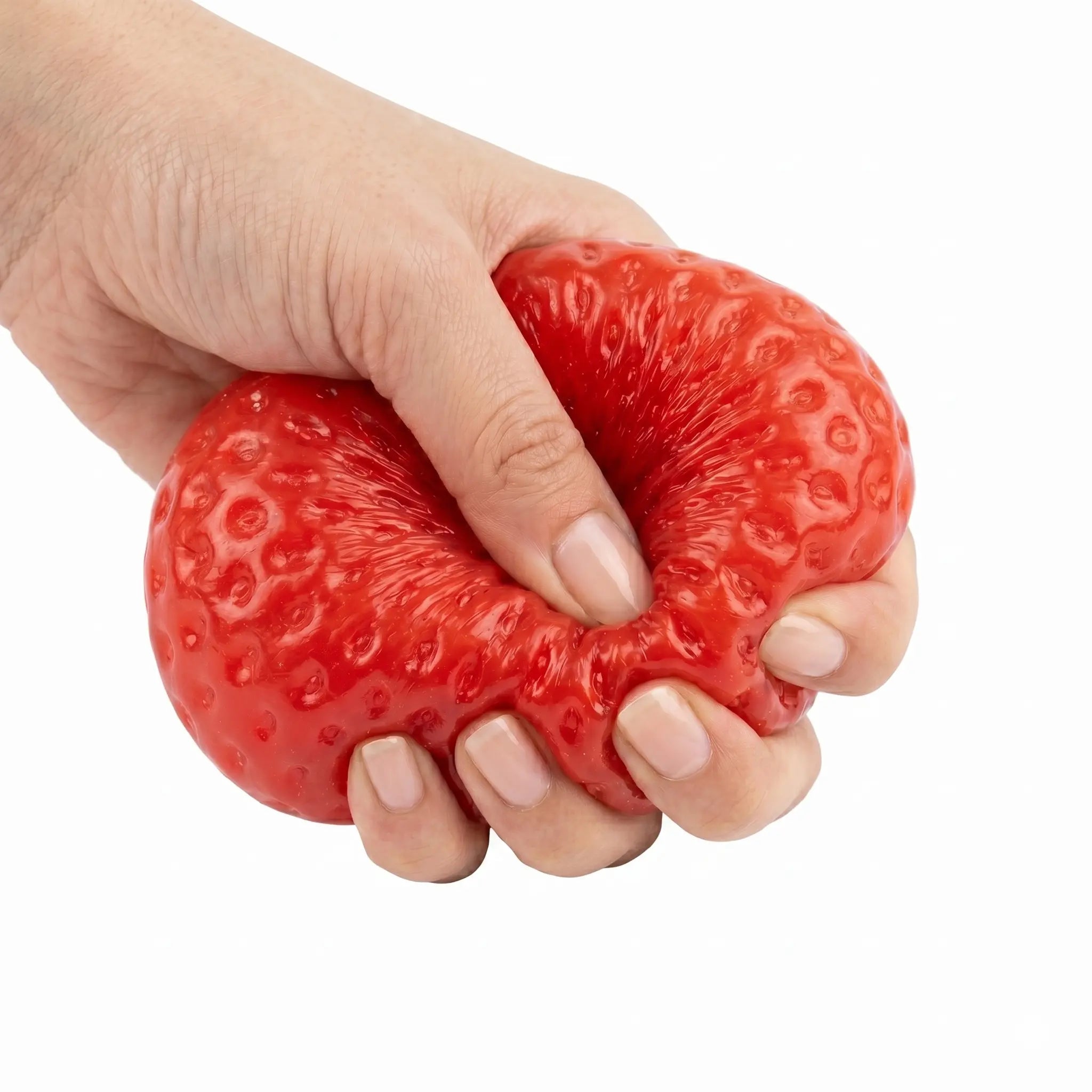 Hands squeezing a soft red strawberry taba squishy by MimiSquishy