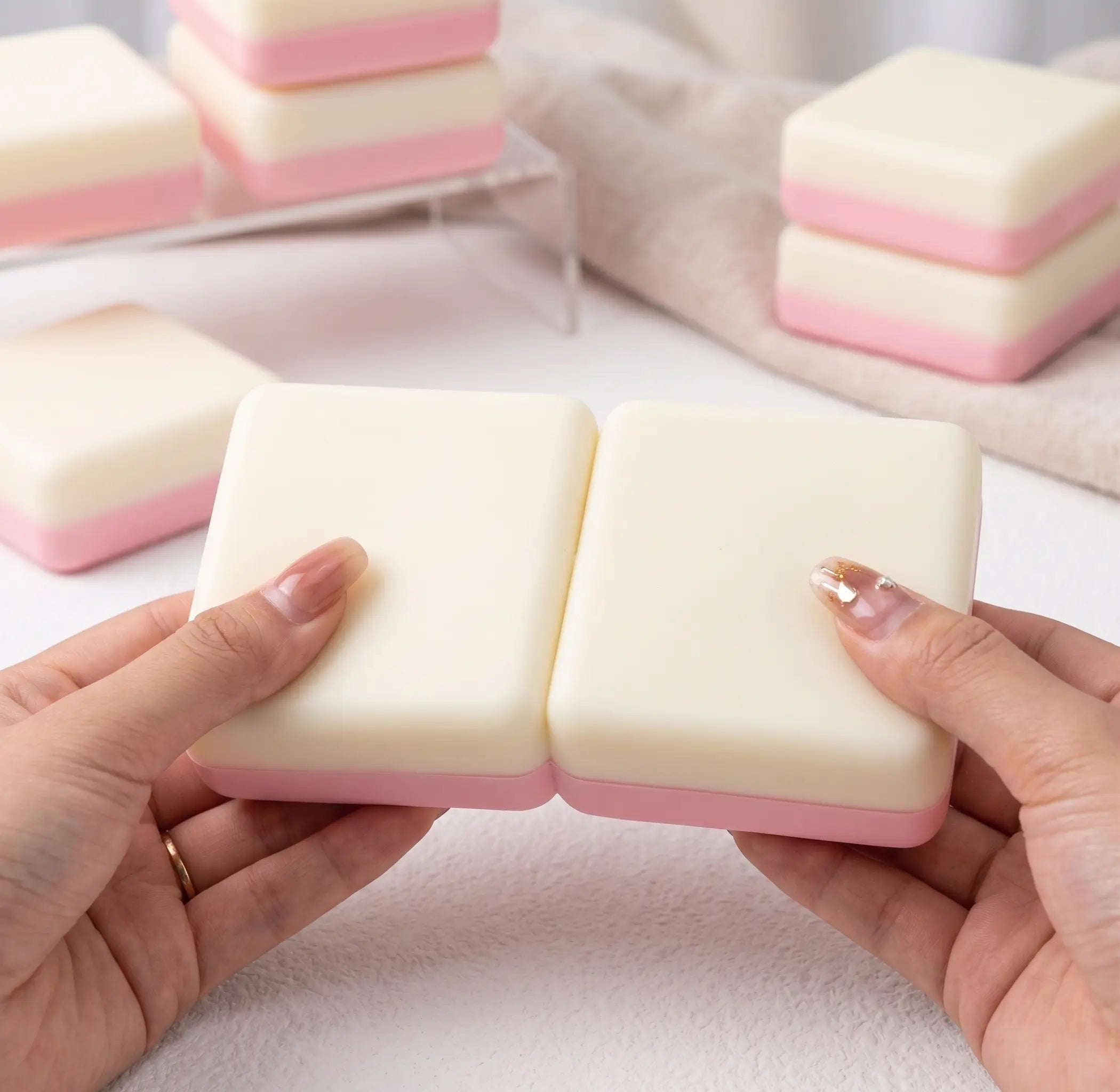 Sticky rice cake taba squishy displayed on a minimal pastel surface with soft Asian-inspired dessert accessories