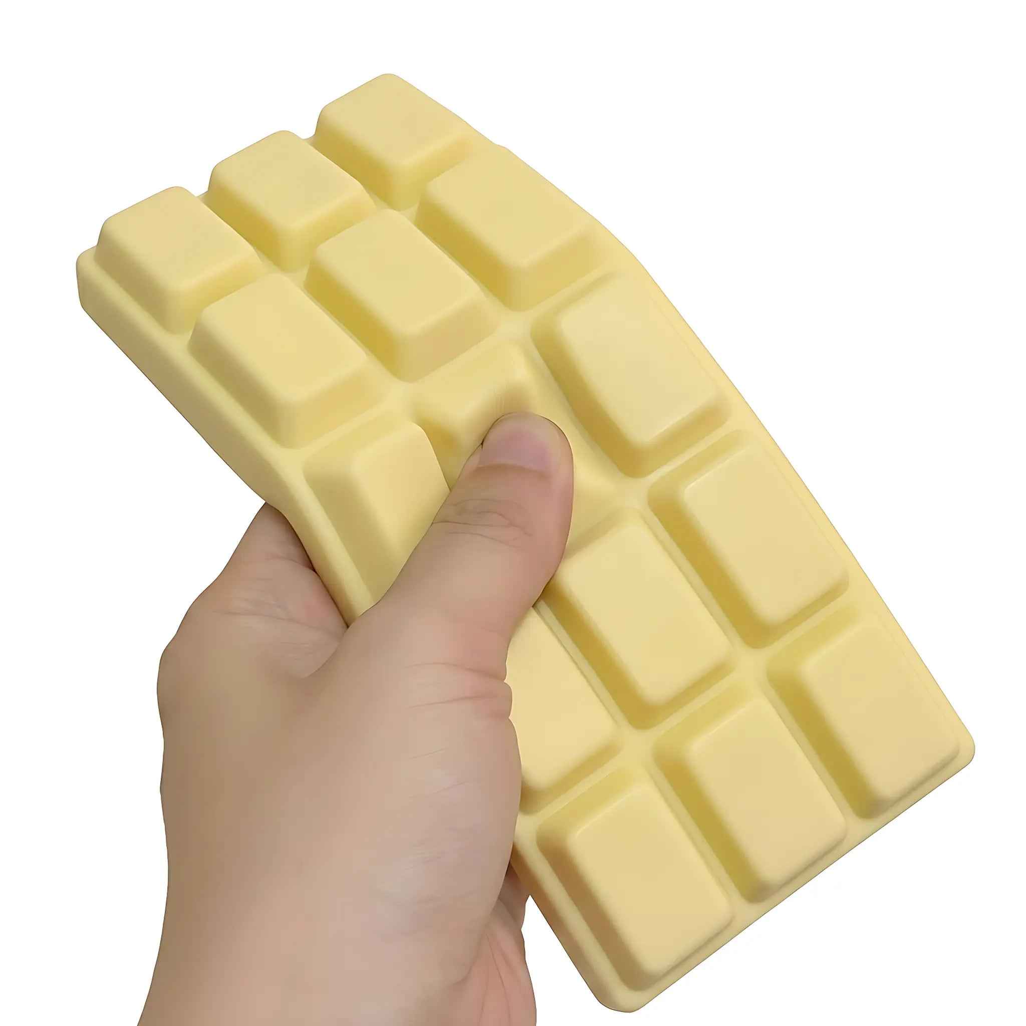 White chocolate bar squishy toy being pressed and squeezed on white background by MimiSquishy