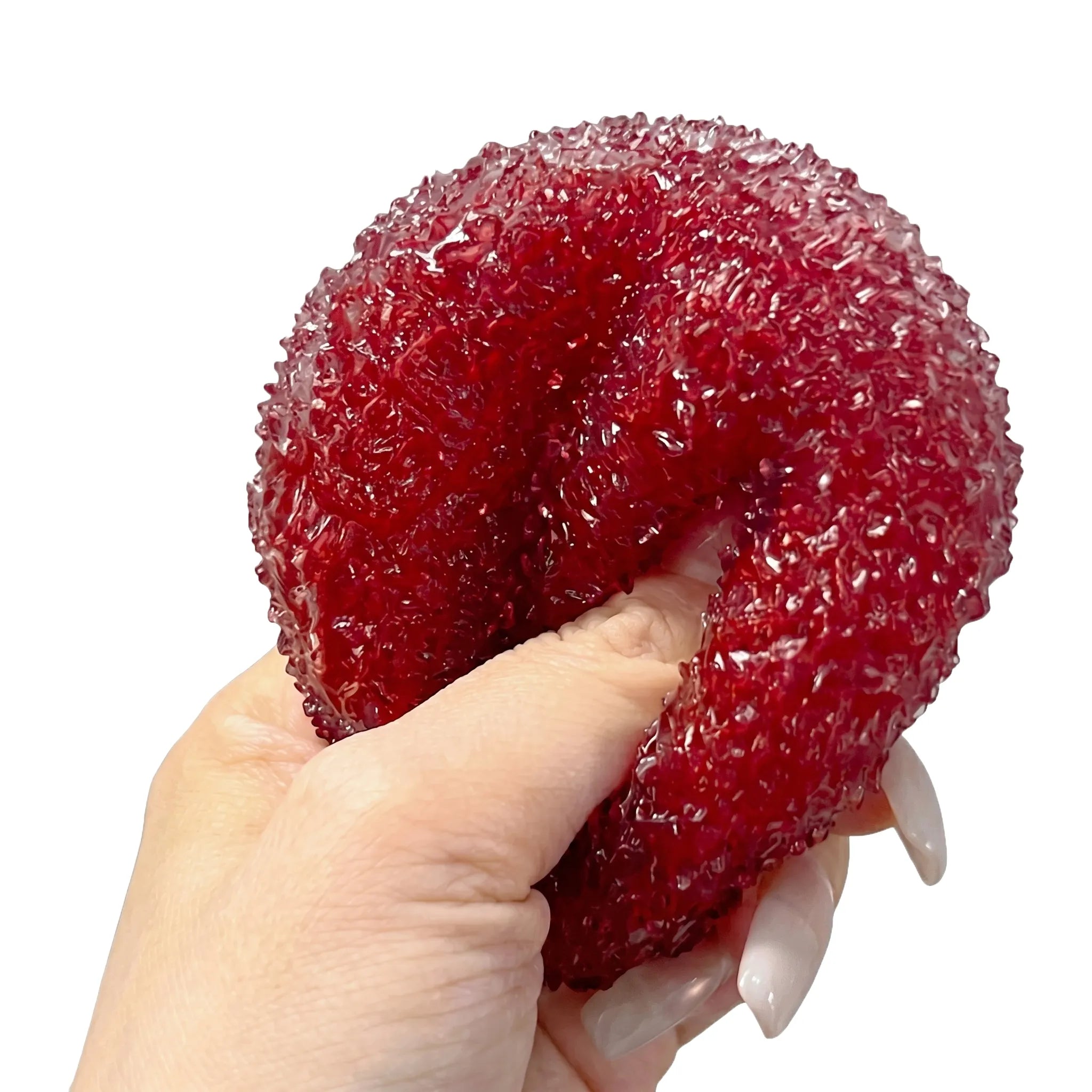 Red yangmei ball squishy toy being pressed and squeezed on white background by MimiSquishy