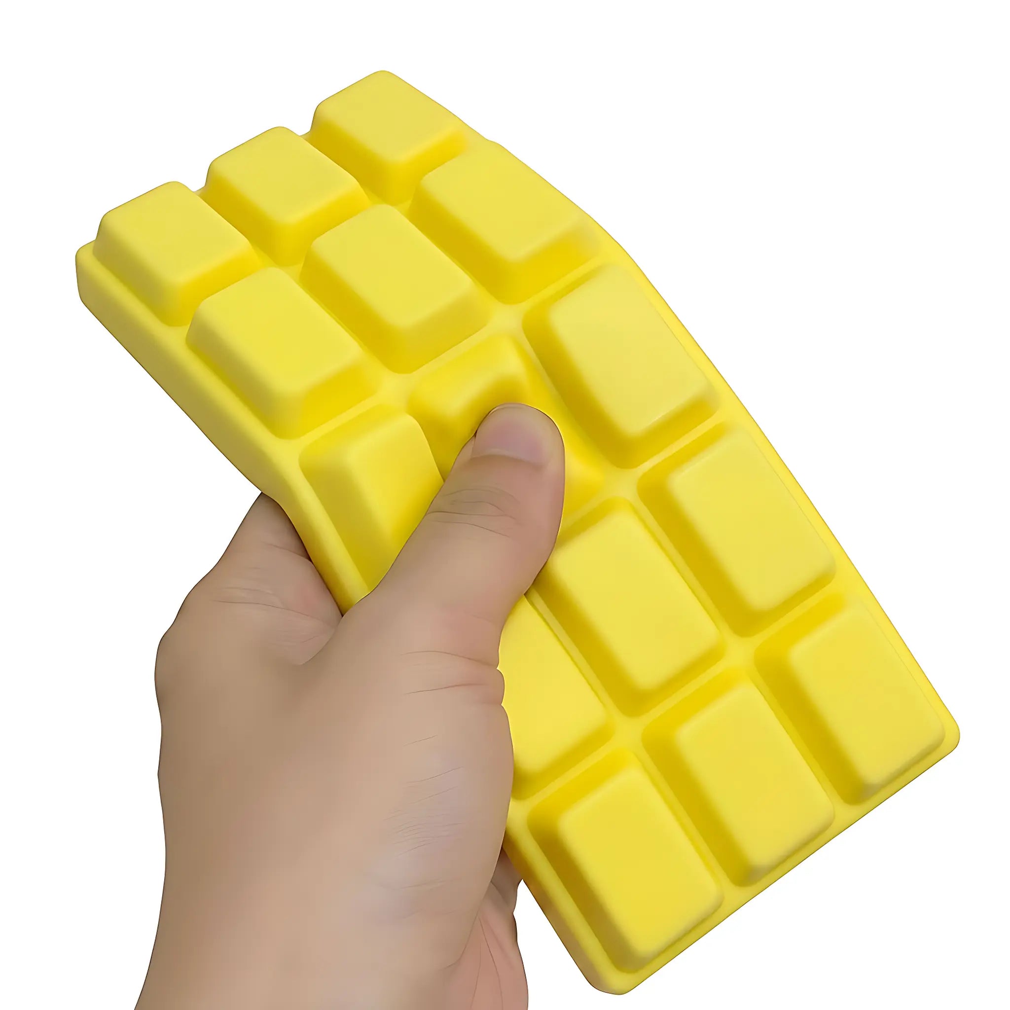 Yellow chocolate bar squishy toy being pressed and squeezed on white background by MimiSquishy