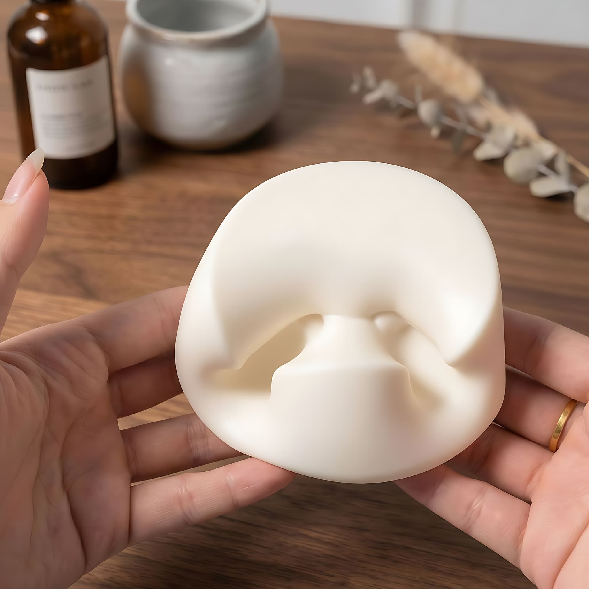 Hands squeezing and pressing a soft taba yogurt cake squishy by MimiSquishy