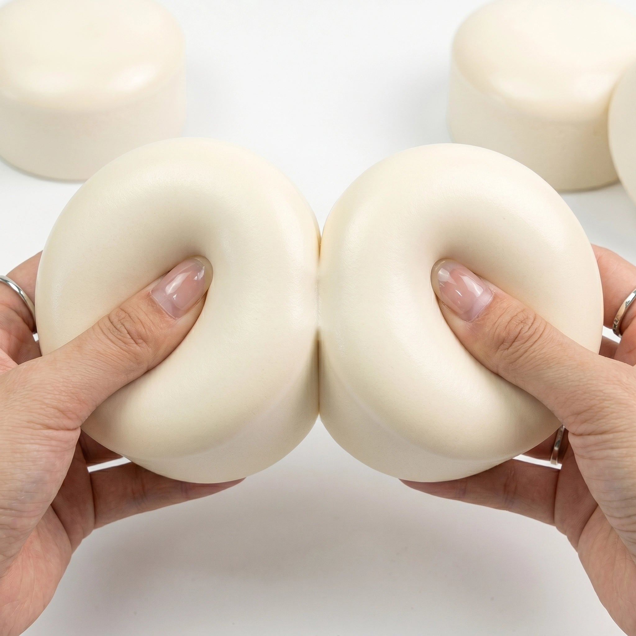 Hands holding two taba yogurt cake squishies pressed together by MimiSquishy